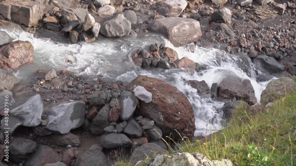 violent mountain river flowing among the stones. top view, wild nature, mountain trip, beautiful landscape violent mountain river flowing among the stones. top view, wild nature, mountain trip, beautiful landscape