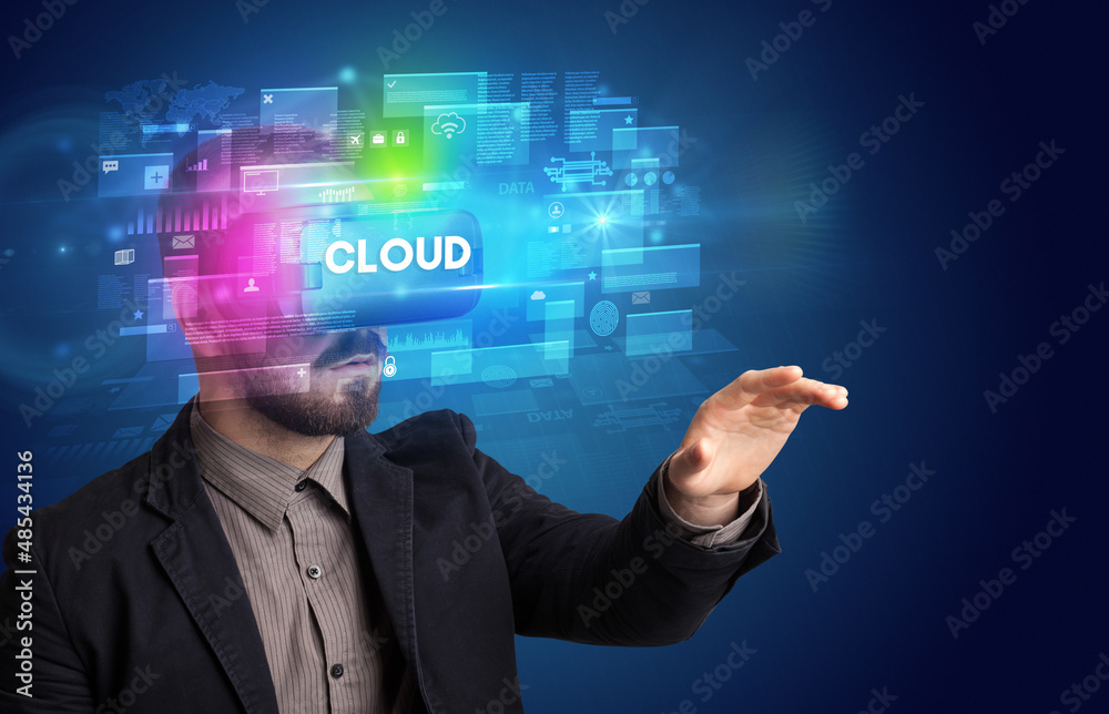 Businessman looking through Virtual Reality glasses Businessman looking through Virtual Reality glasses