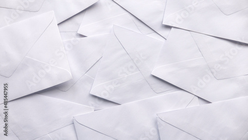 A stack of white envelopes for background.