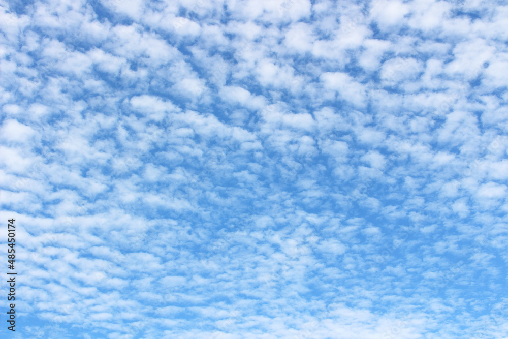 Bright blue sky with white clouds