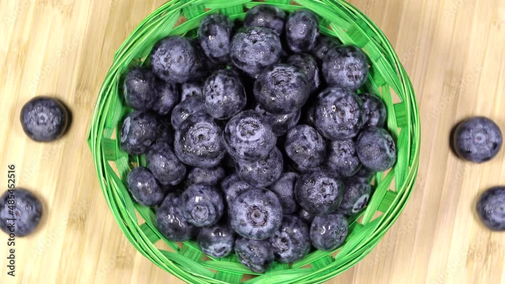 Fresh juicy blueberries in a basket, rotation backgound. Close up. Loop motion Fresh juicy blueberries in a basket, rotation backgound. Close up. Loop motion