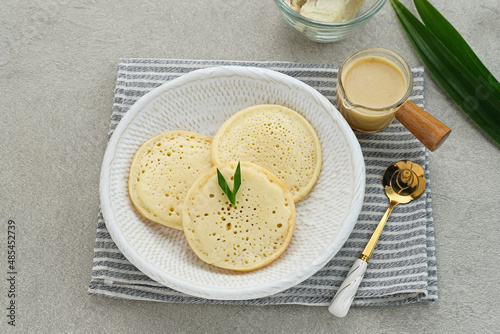 Wallpaper Mural Serabi Durian, Indonesian pancake made of rice flour and coconut milk, served with durian sauce.
 Torontodigital.ca