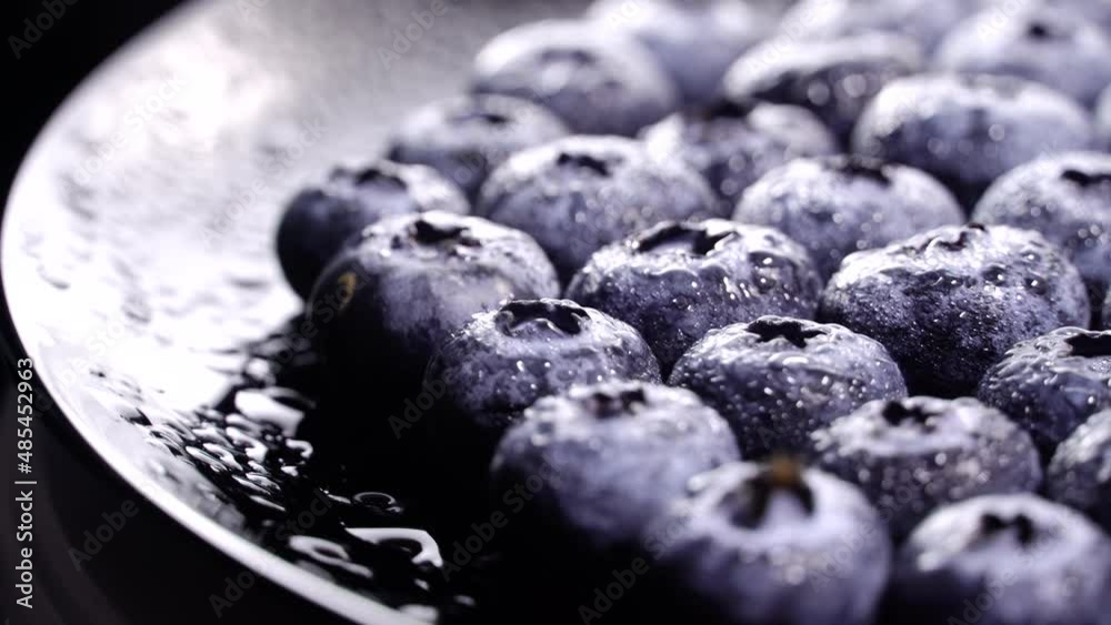 Fresh juicy blueberries rotation backgound. Close up. Loop motion
