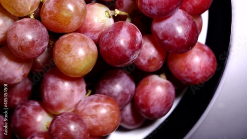 Fresh red grapes rotation background