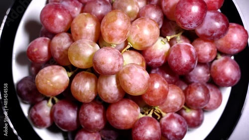Fresh red grapes rotation background