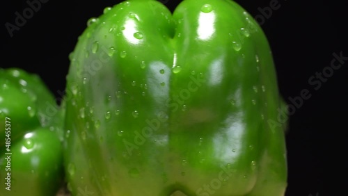 Fresh wet green bell peppers close up rotation