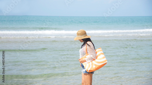 Happy traveler and tourism young women travel summer on the beach. relax outdoor destination leisure trip travel