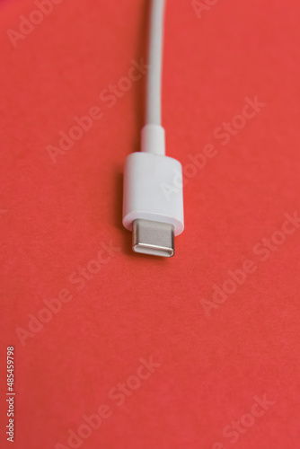 USB cable type C over pink background