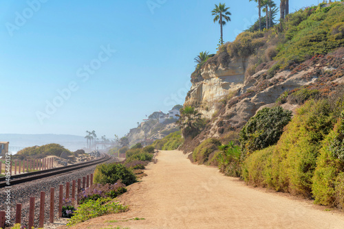 Train track and dirt road at the beach of San Clemente, California photo