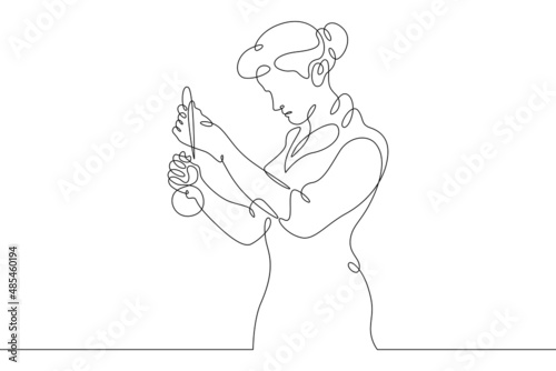 One continuous line.Laboratory assistant in the laboratory. The pharmacist prepares the medicine. The chemist is experimenting. Continuous line drawing.Line Art isolated white background.
