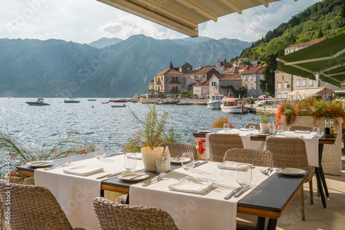 Outdoor restaurant in Perast village in Kotor Bay, Montenegro.
