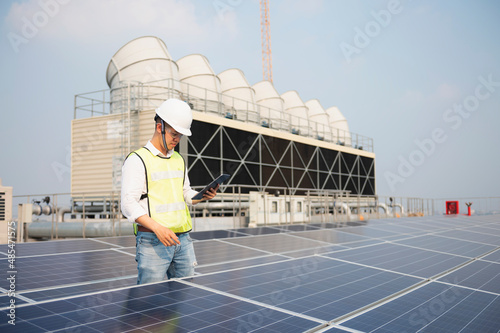 Engineering team working operation and maintenance in solar power plant,engineering team working on checking and maintenance in solar power plant,solar power plant to innovation of green energy © tonjung