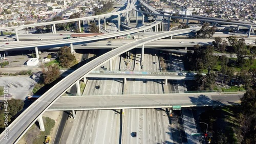 Shot of Judge Pregerson Highway showing multiple Roads, Bridges, Viaducts with little car traffic in Los Angeles, California. Complex Highway Junction. Aerial view on big highway interchange. photo