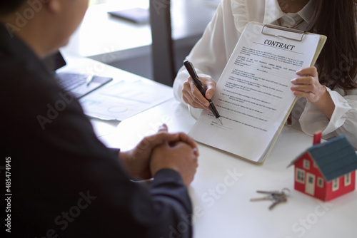 Female real estate agent has a meeting with the new owner