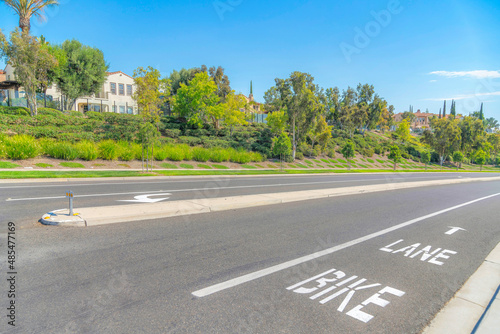 Photography Asphalt road with concrete median barrier at Ladera Ranch in Southern California