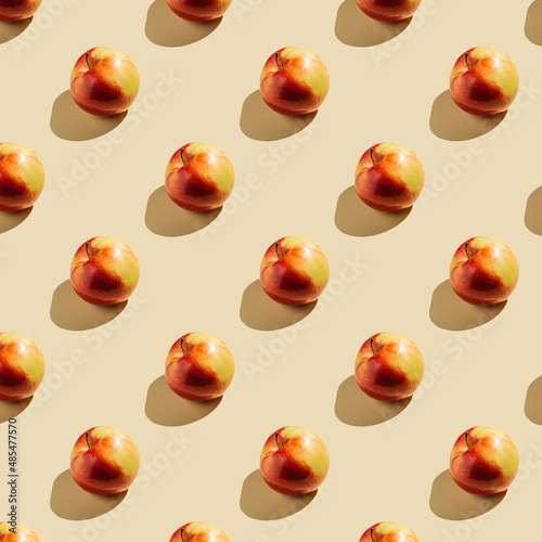 Pattern of apples on a beige background.