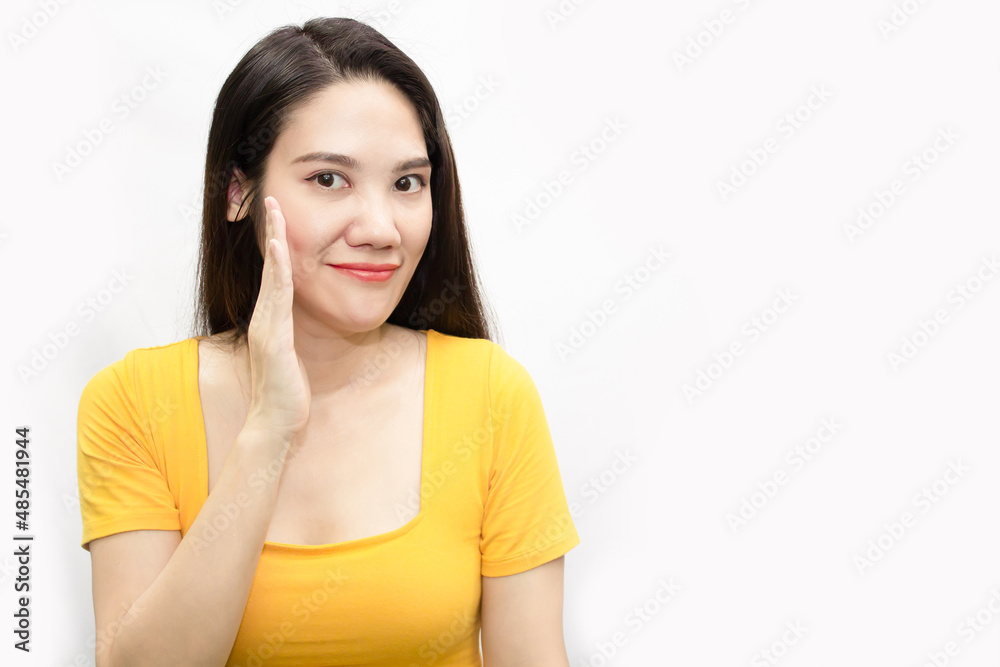 Asian beautiful woman wear green t-shirt are telling or whisper a secret for news and information.