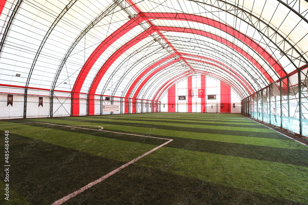 Wide angle image of the Astroturf facility. astroturf sports field empty state. soccer field training Wide angle image of the Astroturf facility. astroturf sports field empty state. soccer field training