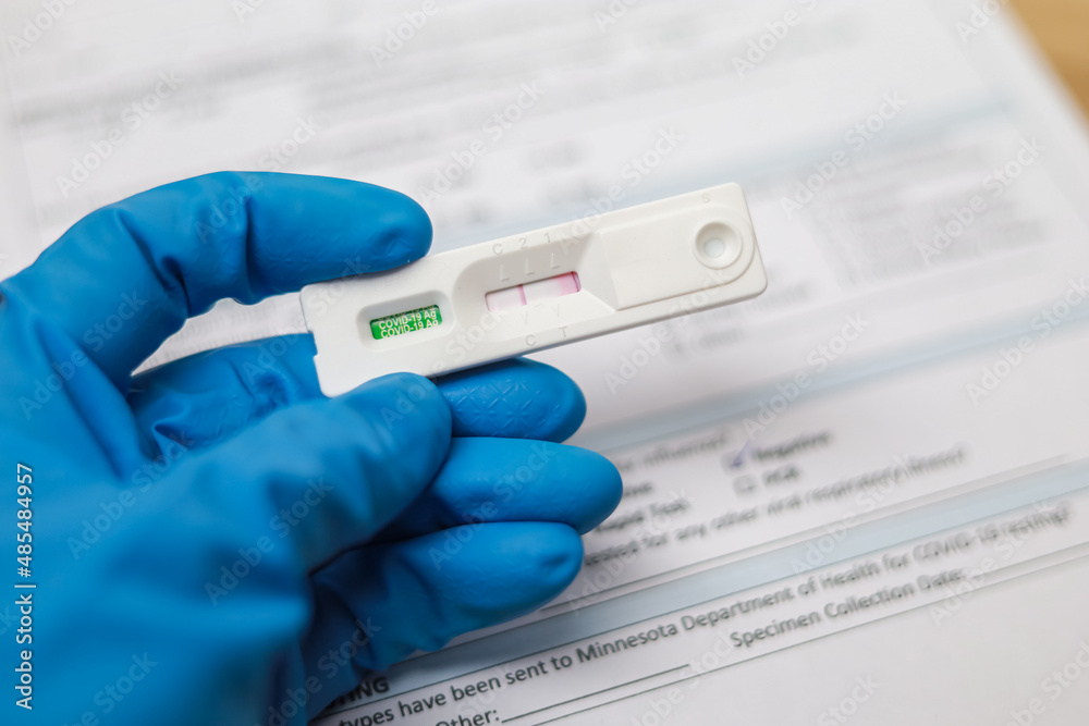 Doctor holding Negative test result coronavirus by using rapid test device for COVID-19 virus, novel coronavirus 2019 found in Wuhan, China