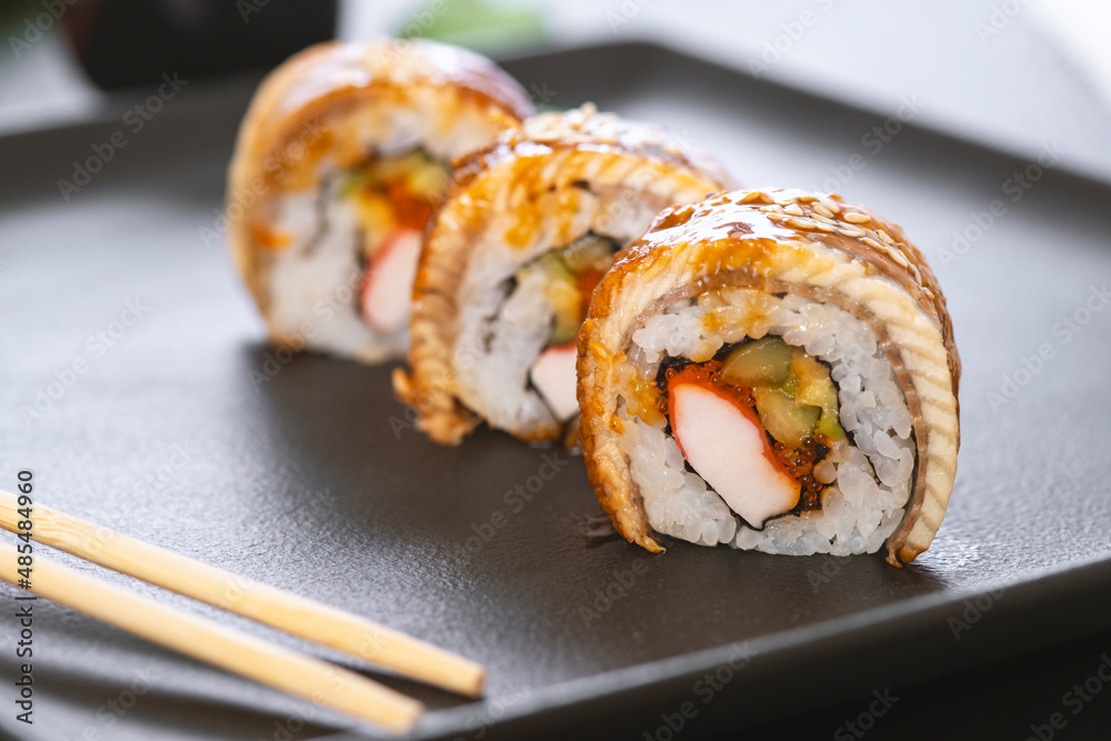 Sushi roll with rice, crab, cucumber, avocado ,tobiko, eel. Sushi menu. Japanese food. Sushi roll with rice, crab, cucumber, avocado ,tobiko, eel. Sushi menu. Japanese food.