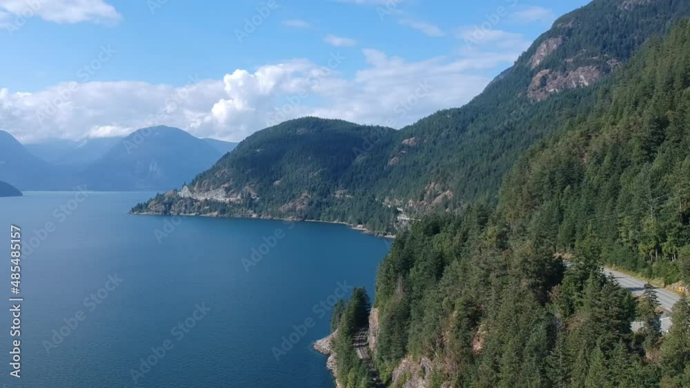 Railway, Highway and Coastal Mountains on Sunny afternoon. Railway, Highway and Coastal Mountains on Sunny afternoon.
