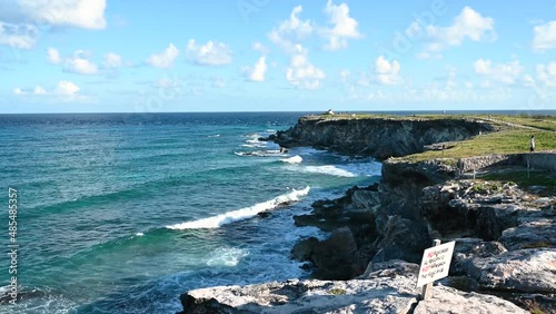 Waves crashing at the temple Ixchel on the island of Isla Mujeres in Punta Sur Mexico photo