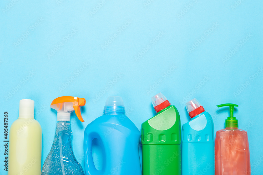 cleaning agent on a blue background on the side. Professional cleaning products, general cleaning. Household chemicals top view cleaning agent on a blue background on the side. Professional cleaning products, general cleaning. Household chemicals top view