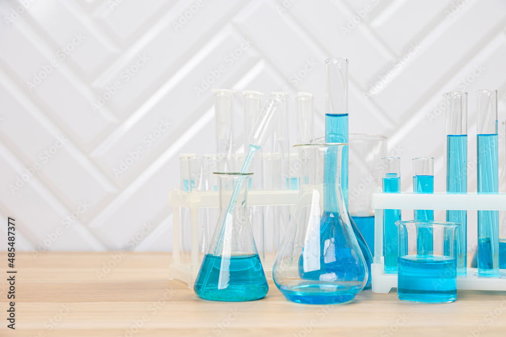 Laboratory glassware with test tubes. flasks, dropper, petri dishes, measuring cups and cylinders for scientific laboratories,