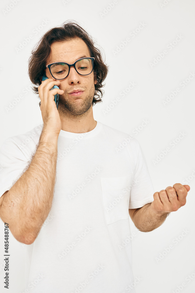 handsome man talking on the phone technologies light background handsome man talking on the phone technologies light background