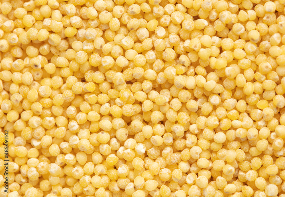 Close-up of millet groats as background. Close-up of millet groats as background.