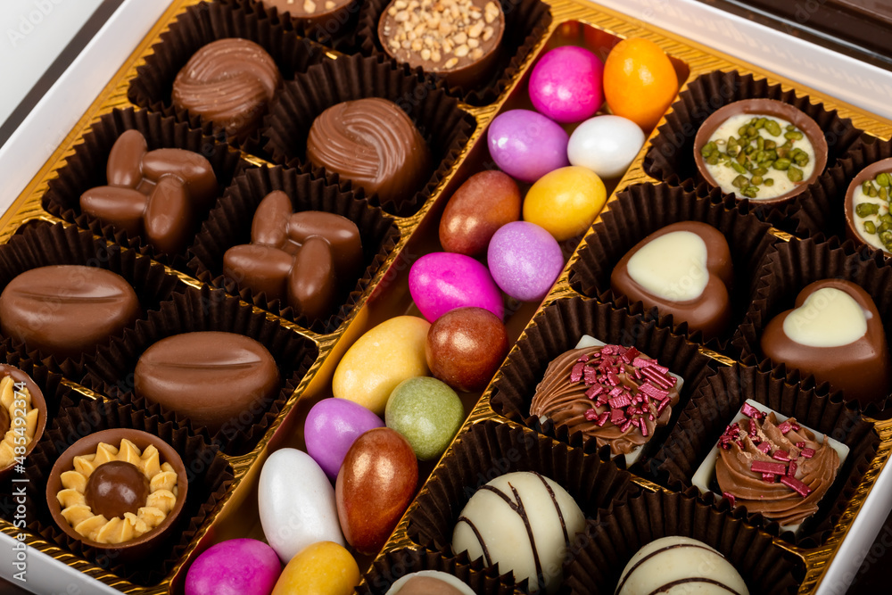 chocolate and colorful candies in a box chocolate and colorful candies in a box