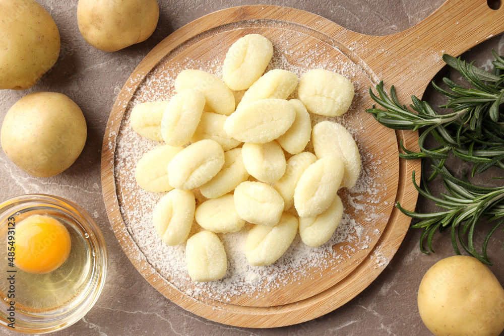 Concept of cooking with raw potato gnocchi, top view Concept of cooking with raw potato gnocchi, top view
