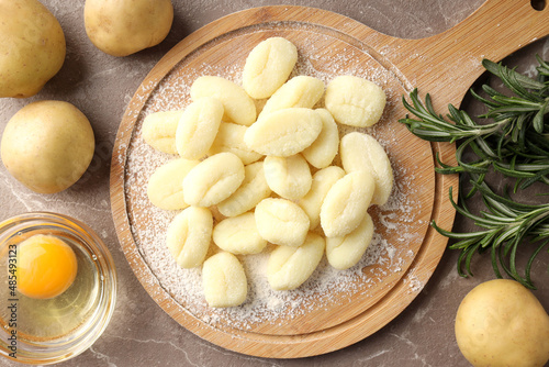 Concept of cooking with raw potato gnocchi, top view