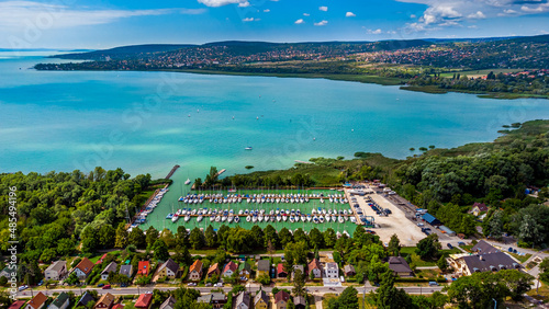 Balatonfuzfo, Hungary - Aerial view of yacht marina at Balatonfuzfo on a sunny summer day with beautiful turquoise Lake Balaton and Balatonalmadi at background