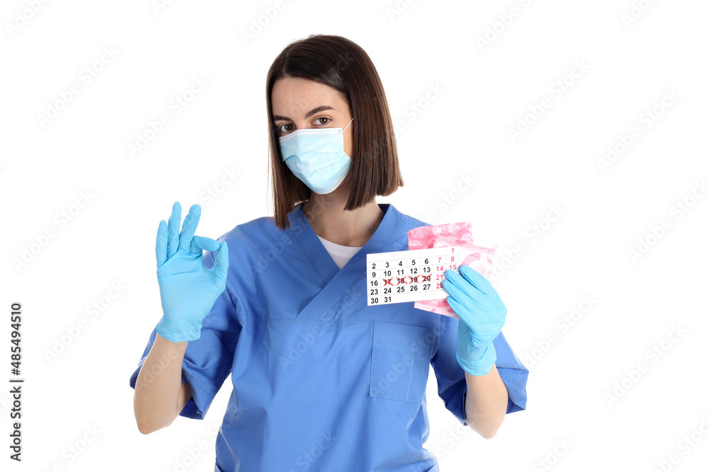 Trainee nurse with pads and period calendar isolated on white background Trainee nurse with pads and period calendar isolated on white background