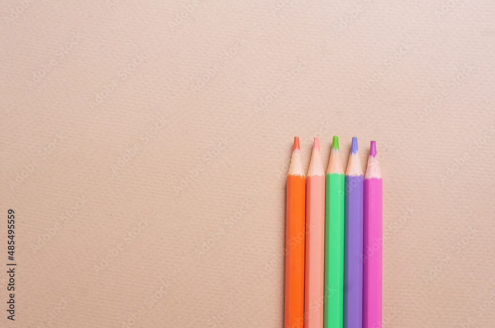 Colorful pencils on light yellow backgroundcreativity concept copy spaccee flat lay Colorful pencils on light yellow backgroundcreativity concept copy spaccee flat lay