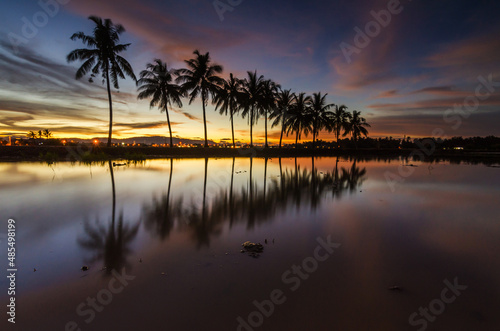 Beautiful sunset scenery at the paddy field with reflections © nadzlanimages