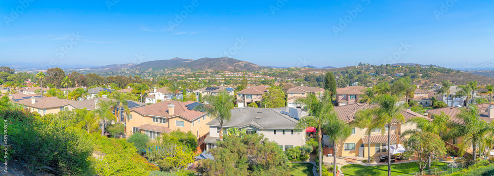 Suburban houses with large yards in a panoramic view at San Diego, California