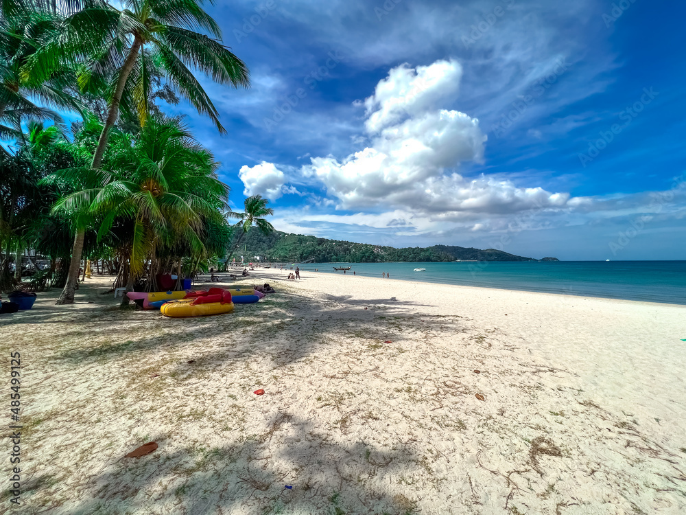 Blue Skies white Sandy Beach and turquoise waters of Patong Beach Phuket Thailand