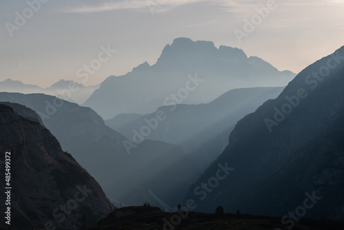 Fototapeta Naklejka Na Ścianę i Meble -  A beautiful shot of Dolomite Mountains with sunrays in Italy