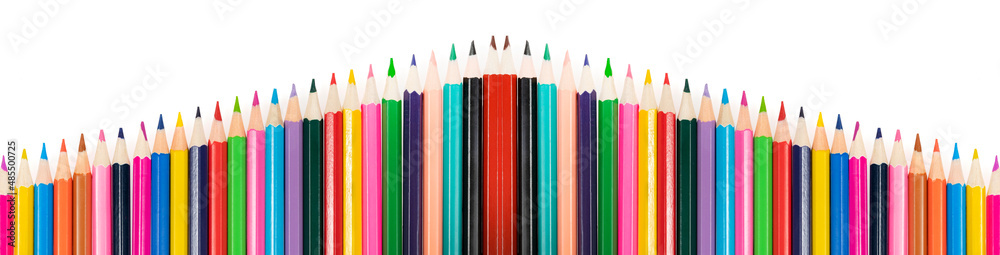 Wooden colored pencils isolated on a white background. A line of multicolored pencils in a large plan Wooden colored pencils isolated on a white background. A line of multicolored pencils in a large plan