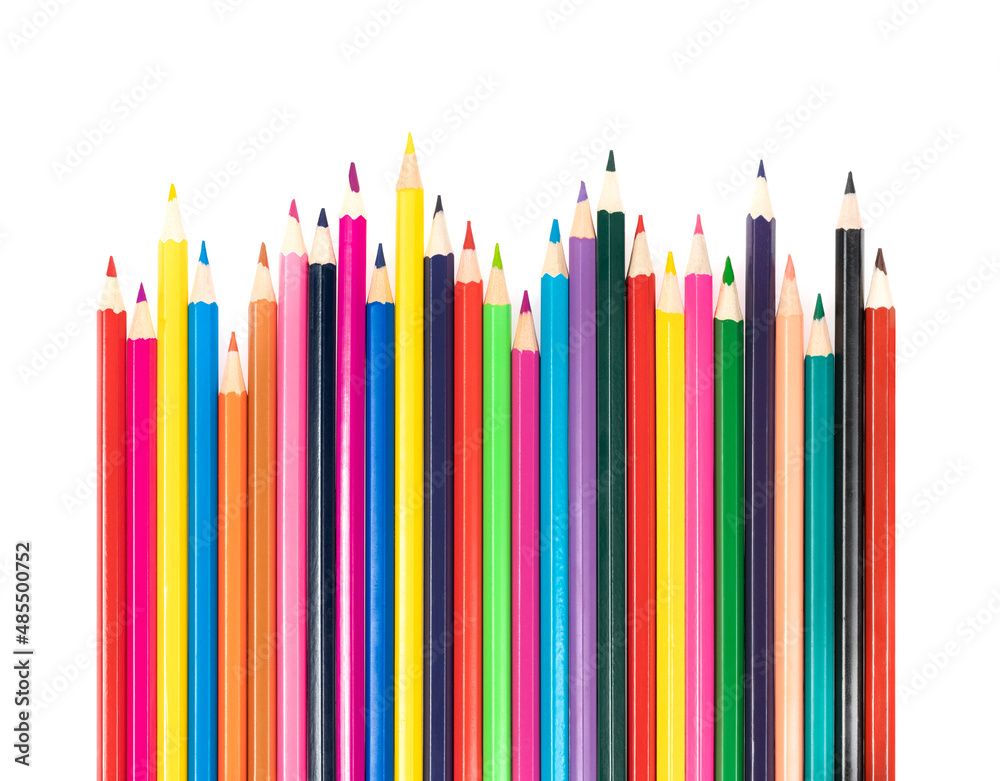 Wooden colored pencils isolated on a white background. A line of multicolored pencils in a large plan Wooden colored pencils isolated on a white background. A line of multicolored pencils in a large plan