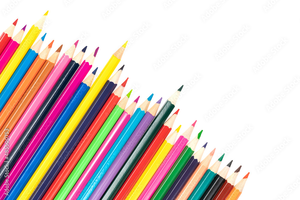 Fototapeta premium Wooden colored pencils isolated on a white background. A line of multicolored pencils in a large plan
