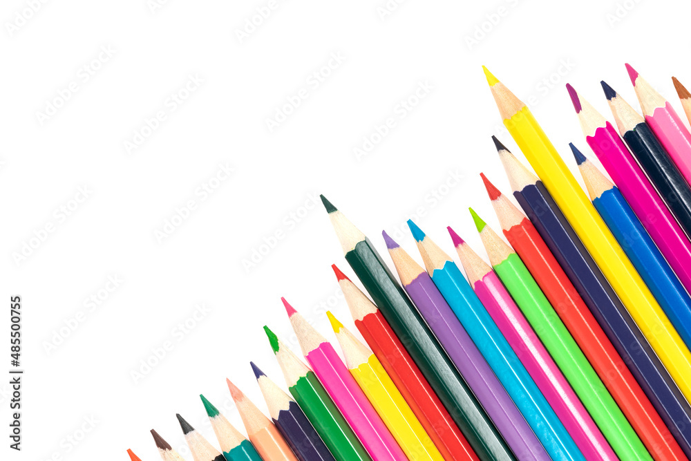 Wooden colored pencils isolated on a white background. A line of multicolored pencils in a large plan Wooden colored pencils isolated on a white background. A line of multicolored pencils in a large plan