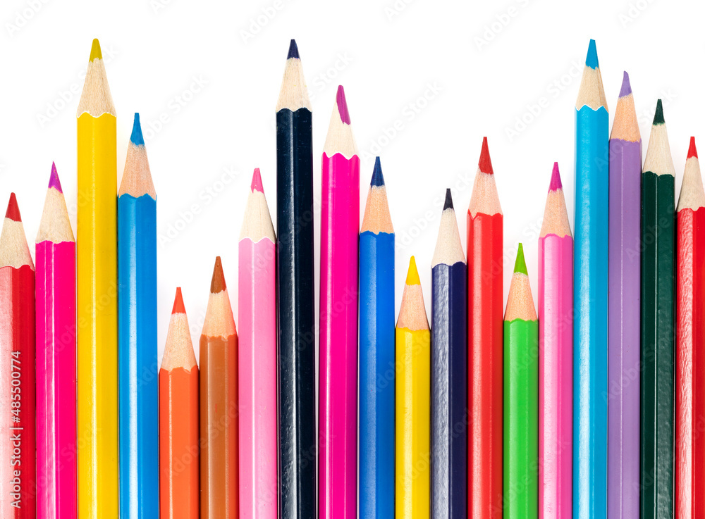 Wooden colored pencils isolated on a white background. A line of multicolored pencils in a large plan Wooden colored pencils isolated on a white background. A line of multicolored pencils in a large plan