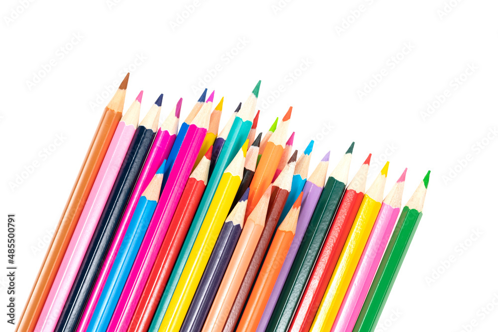 Wooden colored pencils isolated on a white background. A line of multicolored pencils in a large plan Wooden colored pencils isolated on a white background. A line of multicolored pencils in a large plan