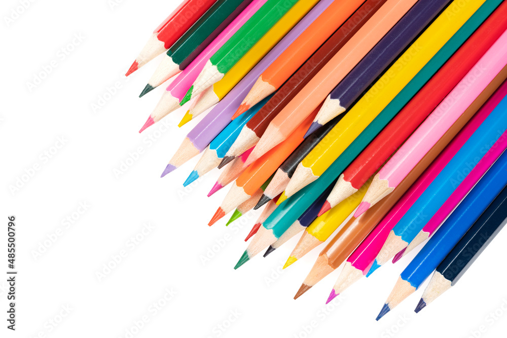 Wooden colored pencils isolated on a white background. A line of multicolored pencils in a large plan