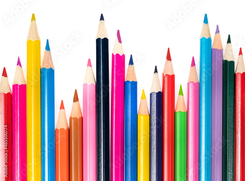 Wooden colored pencils isolated on a white background. A line of multicolored pencils in a large plan