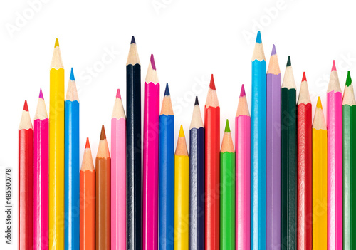 Wooden colored pencils isolated on a white background. A line of multicolored pencils in a large plan