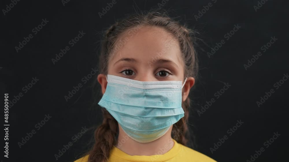 Girl in protective mask. Child face in safety mask. Prevention of diseases by virus. Portrait of girl in protective mask. Schoolgirl in medical mask. Close-up of child face. Fighting virus at school Girl in protective mask. Child face in safety mask. Prevention of diseases by virus. Portrait of girl in protective mask. Schoolgirl in medical mask. Close-up of child face. Fighting virus at school